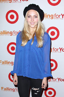 AnnaSophia Robb wearing ripped jeans and blue top