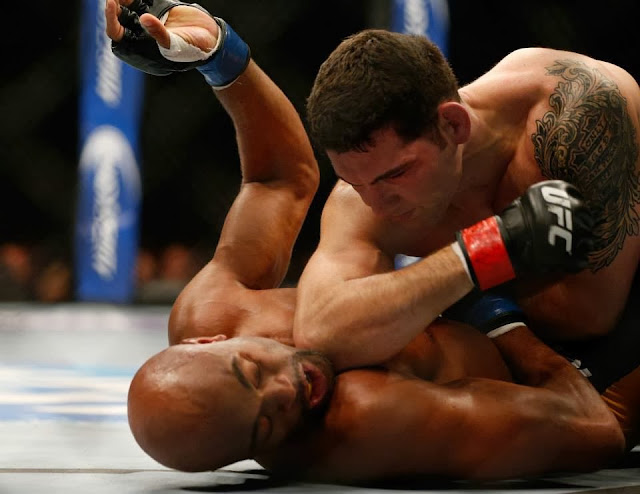 Photo courtesy of fb.com/UFC UFC 168 Weidman elbow pounding Silva on the ground