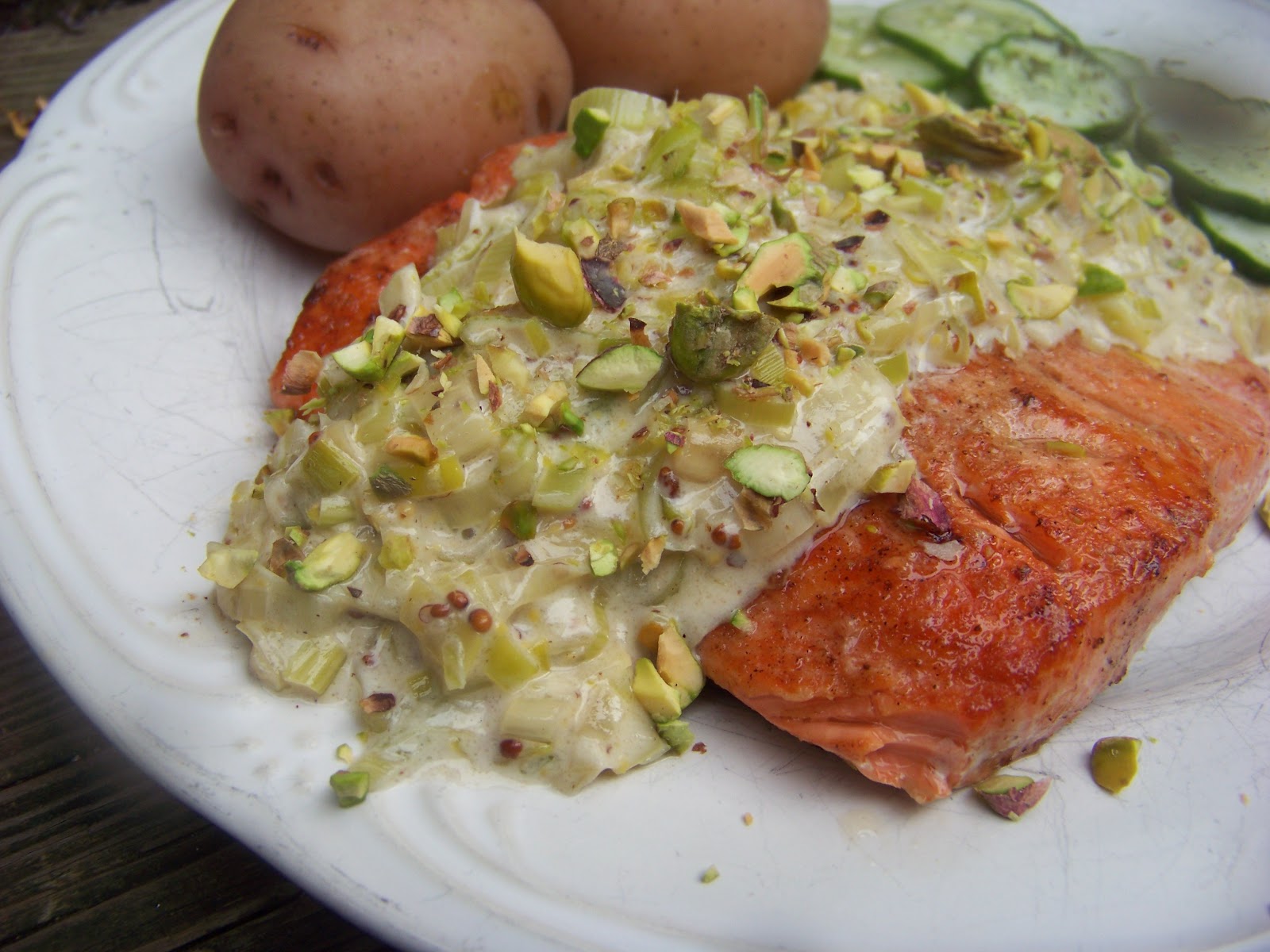 Tora's real food Salmon with leekmustard sauce and pistachio topping