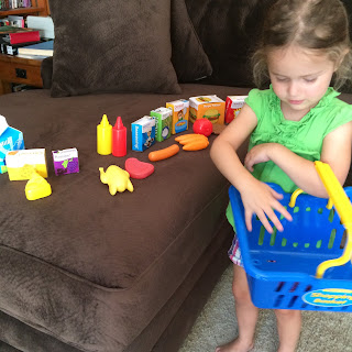 toddler shopping with #thelearningjourney play and learn shopping basket toy