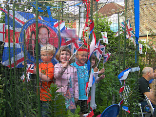 wave your patriotic flags kids in tomato cage