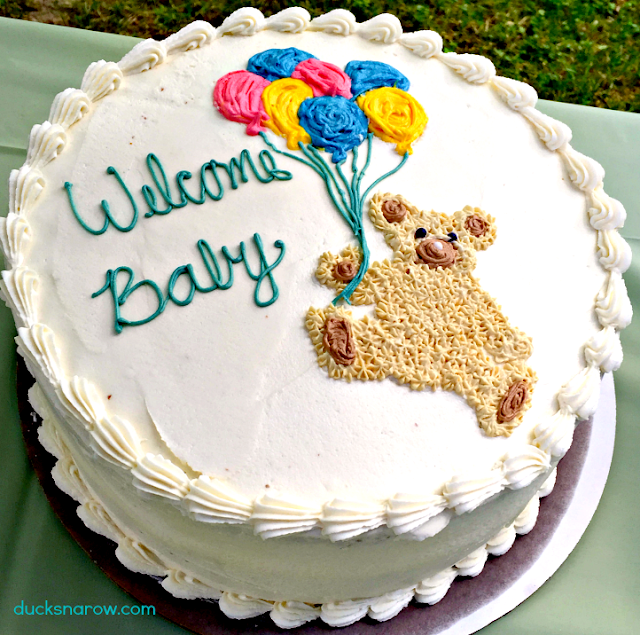 Baby shower cake for a boy baby adorned with a teddy bear and festive balloons baby shower cake, white almond wedding cake recipe, boy baby showers, girl baby showers