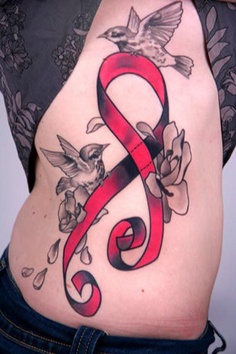 Red ribbon  and flying sparrow tattoo on side body 
