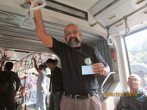 Inside the "Jakarta Shuttle Bus" holding the "Season ticket".