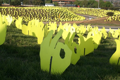 Commissioned artwork or installation art by Strijdom van der Merwe in South Africa of a field of yellow hands