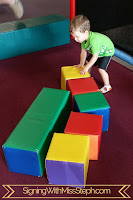 three year old builds with giant foam blocks