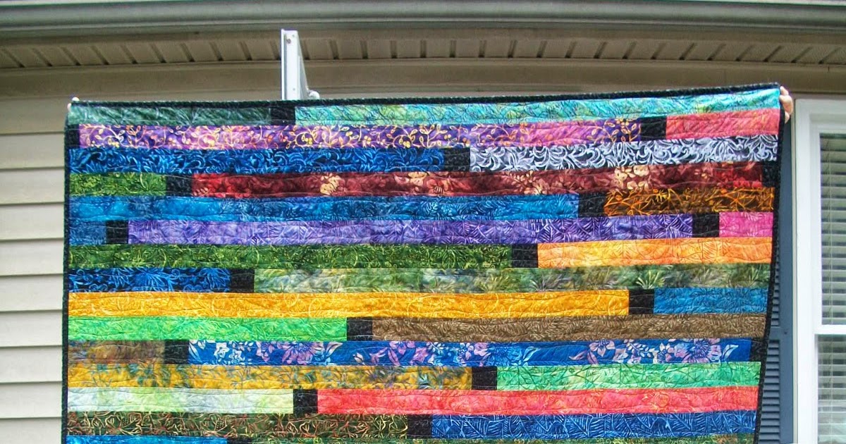 Sew Cook and Travel Dark Batiks Jelly Roll Race Quilt with Spacers