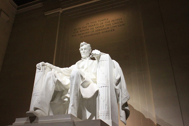 The side view of President Abraham Lincoln's statue at night at Lincoln Memorial in Washington DC, USA The side view of President Abraham Lincoln's statue at night at Lincoln Memorial in Washington DC, USA