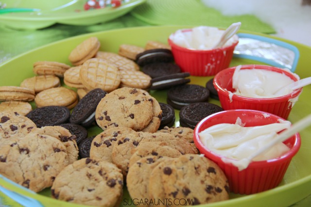 Throw a Cookie Decorating Party or play date this Christmas season. I love the cookie box gingerbread village at this kid-friendly party!