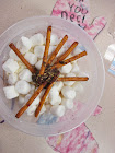 A crunchy snowflake pretzel with chocolate glue.