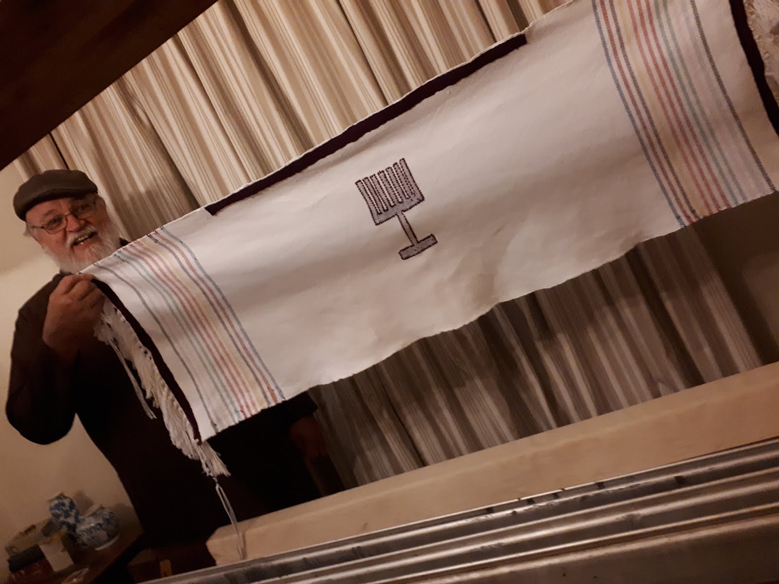 A finished tallit that is narrower than the others