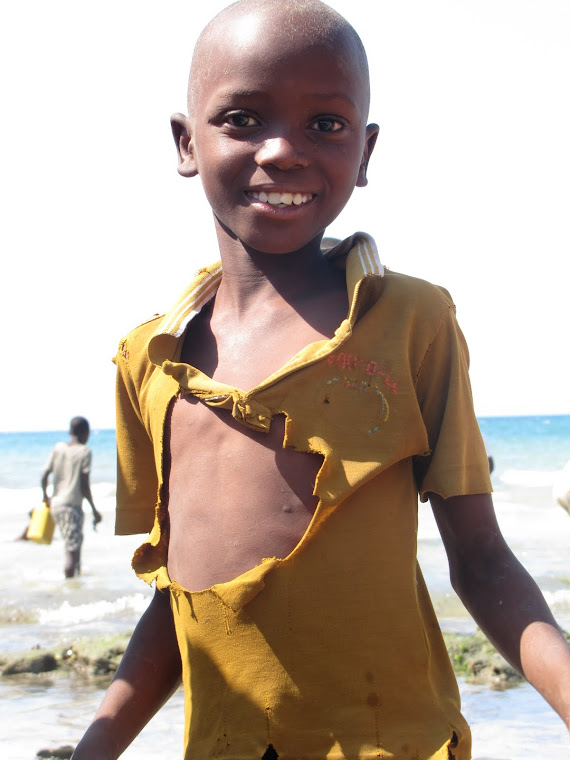 Baptism on the beach..this is one of the village kids!