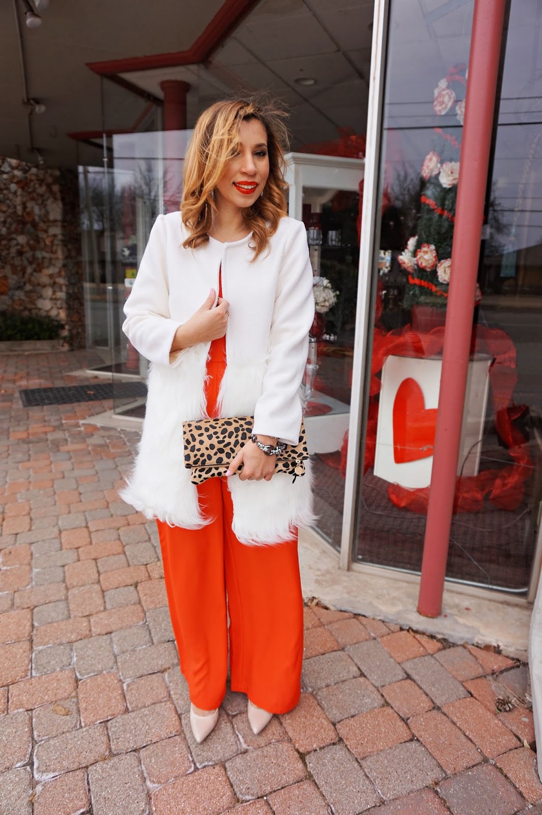 13. Red jumpsuit and white fur jacket.