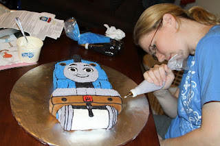 I decided to ice Thomas all the way down to the cake board with stars, instead of white icing him and leaving the sides white...just gave him more dimension, and saved me the time of trying to smooth out the crumb coat!