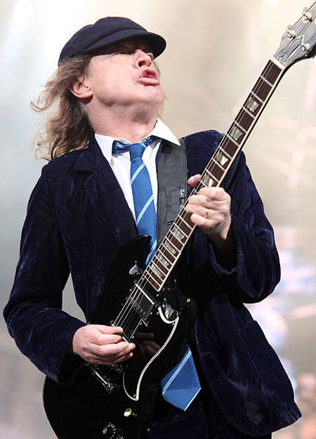 angus-young-acdc-wearing-his-signature-striped-tie.jpg