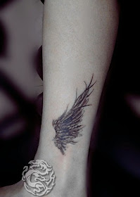 angel wing tattoo on the ankle