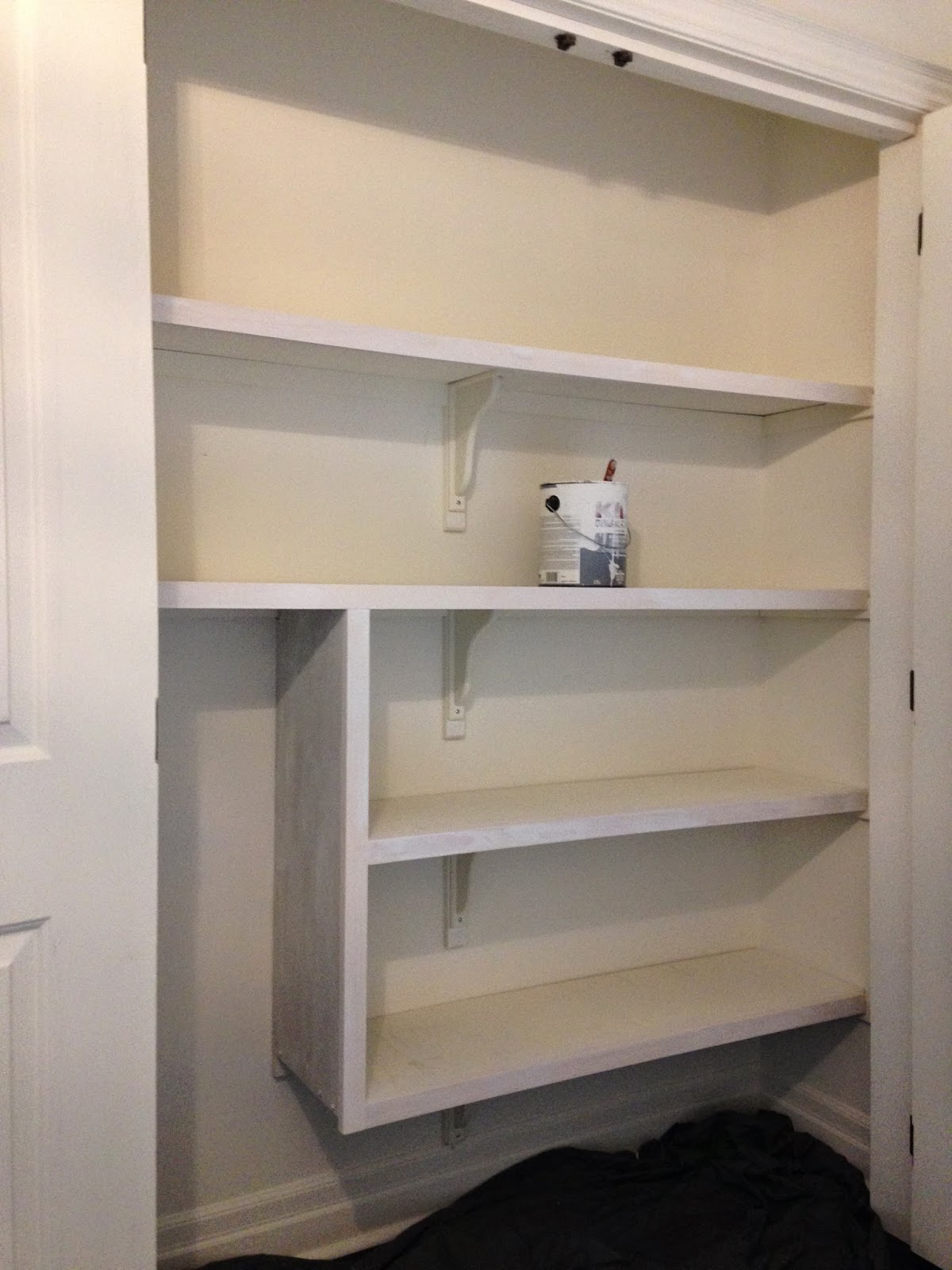 White Wood linen closet organization