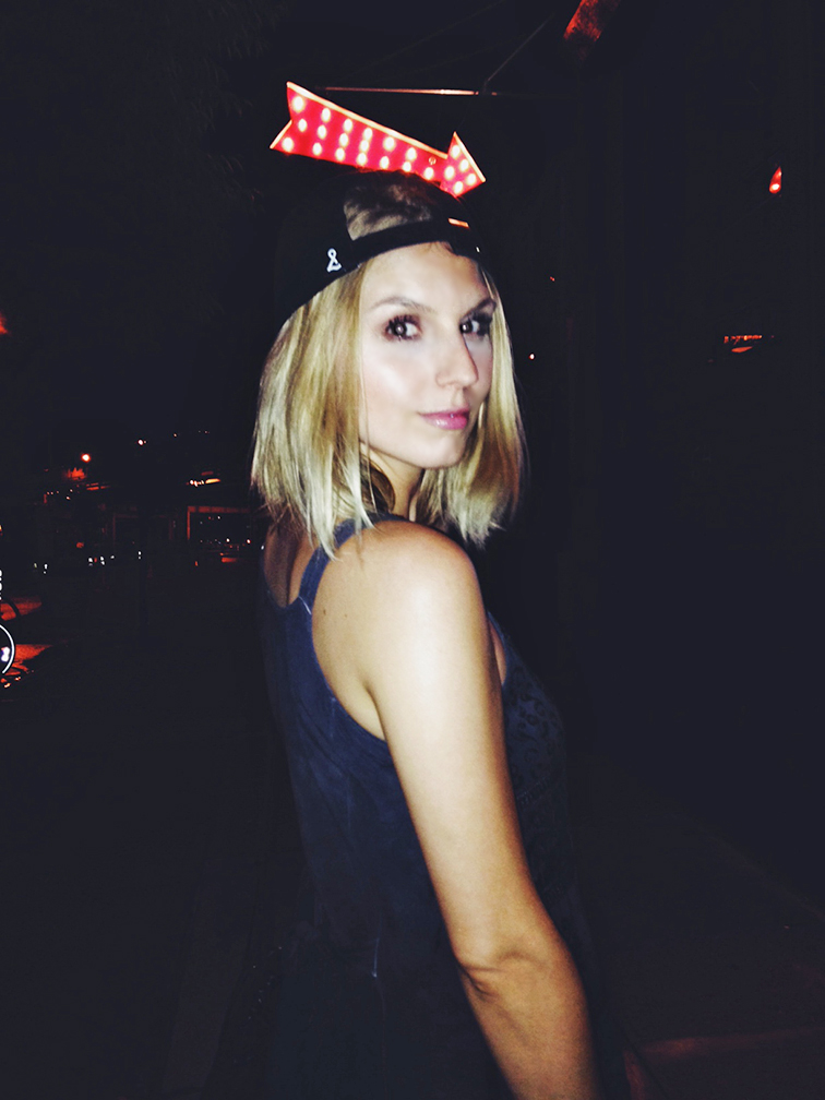 Bow & Drape baseball hat worn backwards, nighttime, Brooklyn, New York Bow & Drape baseball hat worn backwards, nighttime, Brooklyn, New York
