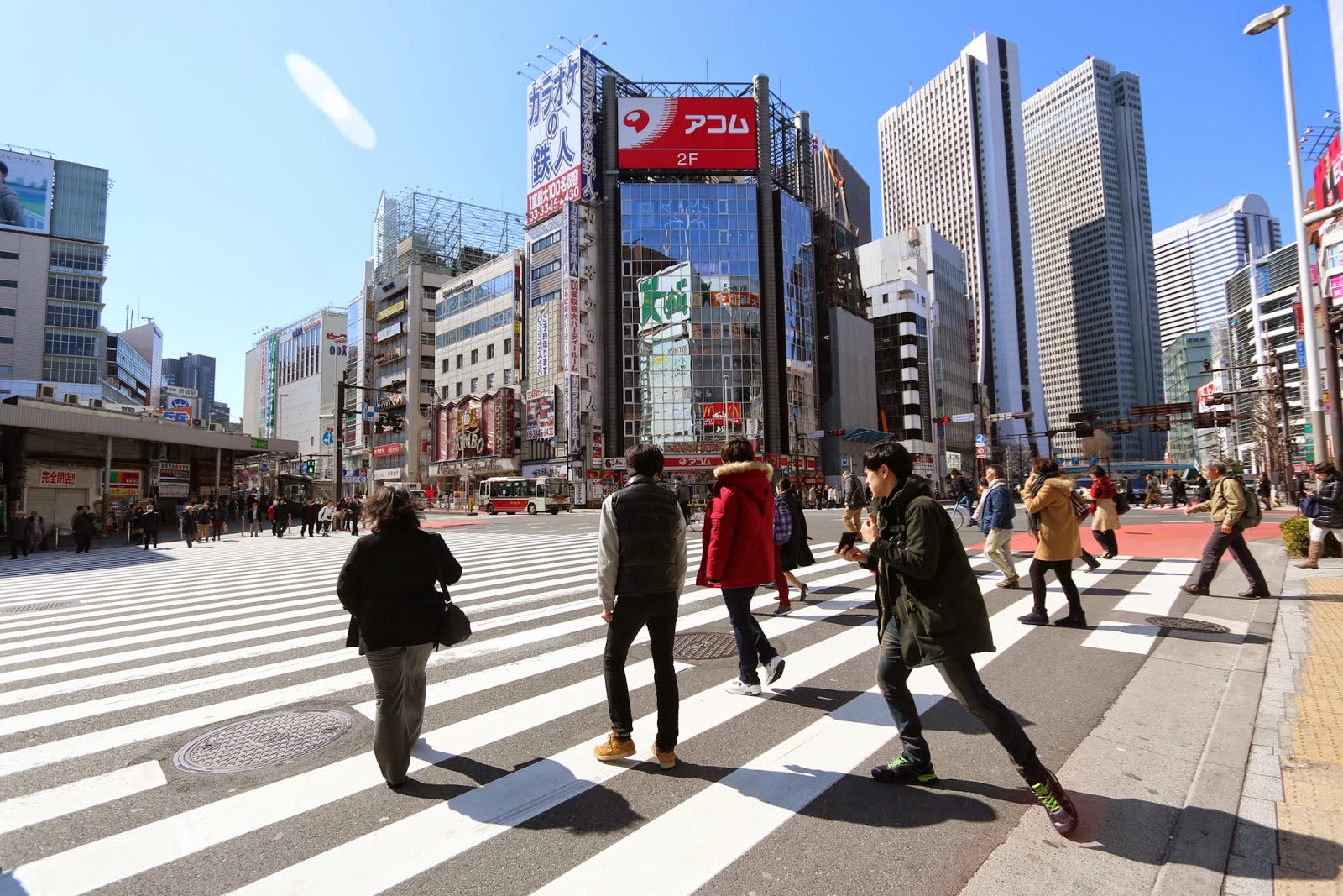 Crossing on the pedestrian crossing when the pedestrian light turns green is mainly practised by Japanese on the road safety etiquette in Japan Crossing on the pedestrian crossing when the pedestrian light turns green is mainly practised by Japanese on the road safety etiquette in Japan