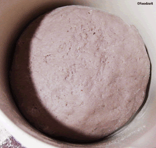 After shaping the bread, following the instructions of the above video, the bread now is resting in the fermentation basket