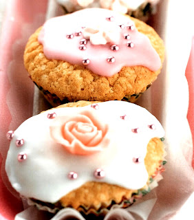 pink iced (frosted) cupcakes