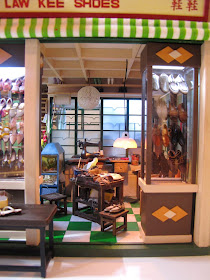 The entrance of a miniature model of a Hong Kong shoe shop from the 1960s.