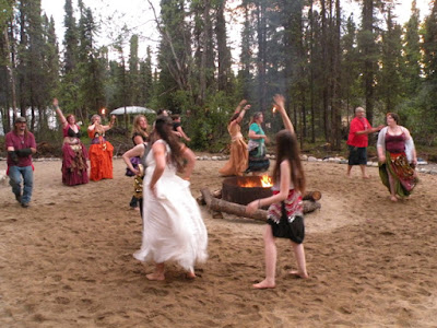 Dancing around the fire, Solstice 2014. Note the red suspenders, a designation of Fire Tribe, safety on active duty.