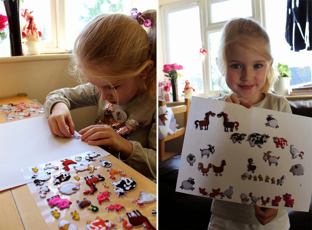 christmas morning, girl palying with stickers, presents, todaymyway.com