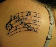 Let music be the voice ink tattoo on back body