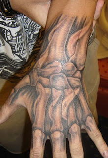 bones tattoo on the hand