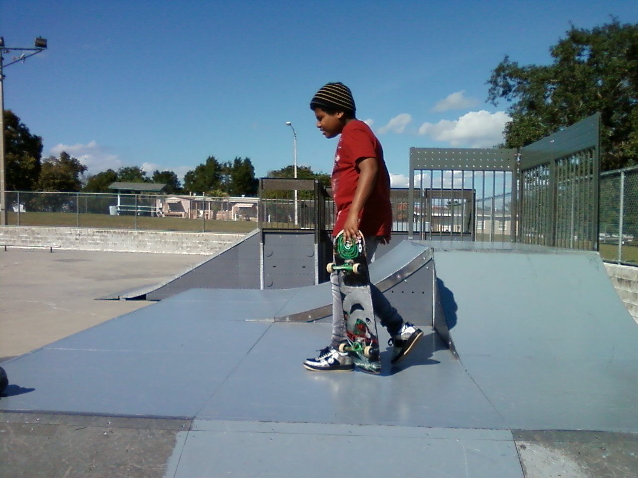 13 year old son skateboarding at the skate park