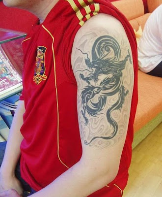 black dragon free tattoo design on the arm