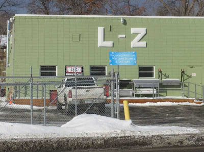 Green block building with large sign that says L-Z
