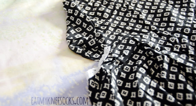 Wholesalebuying Fashion Review: Printed Cutout Romper This romper from Wholesalebuying features an allover geometric print, tie-back halter neckline, asymmetric hem, hidden zipper, and side cutouts with a thin crochet trim.