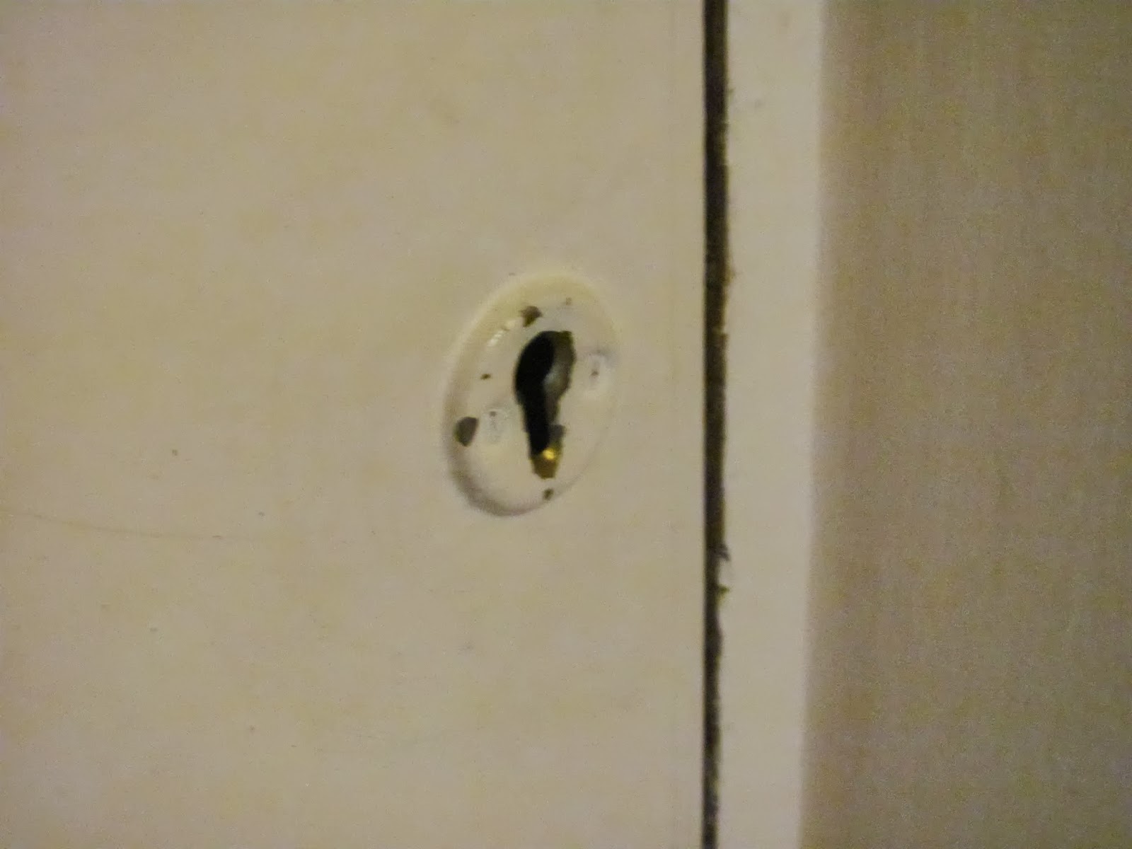 Skeleton Keyhole A keyhole for a skeleton key on a white painted door