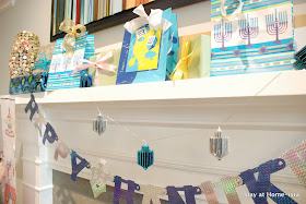 Hanukkah themed mantle with gifts