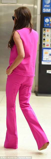 Victoria Beckham stuns in hot pink outfit at JFK airport (photos) 2C13A1EF00000578-3226573-image-m-113_1441726589177