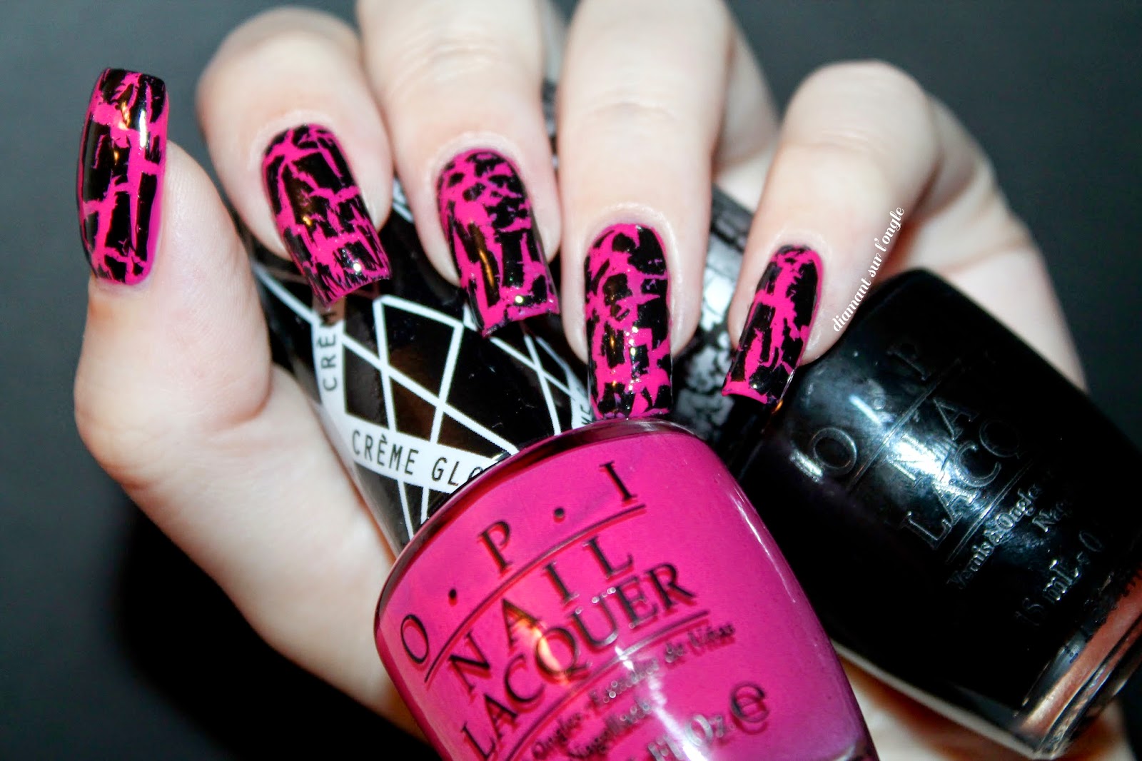 black and pink nail art done with a black shatter nail polish