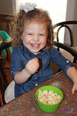 Homemade Yogurt Melts - my daughter enjoying her snack Homemade Yogurt Melts, Yogurt Melts, DIY yogurt Melts, Frozen Yogurt melts, Toddler Snack
