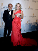 Sharon Stone in a glamorous red gown on the red carpet