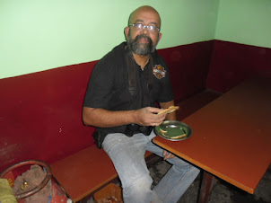 Seafarer/Blogger/Traveller Rudolph.A.Furtado in Kargil tasting the famous Kargil confectionery.