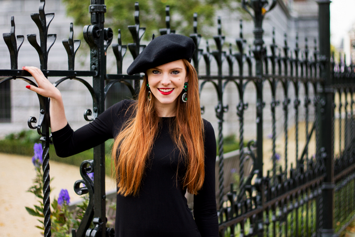 Red hair, emerald earrings, beret and black dress outfit