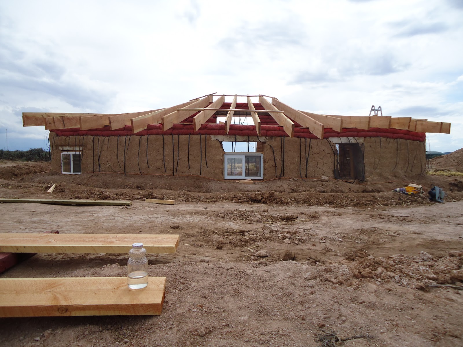 Building An Earthbag Home in Northern New Mexico Roof Beams up and