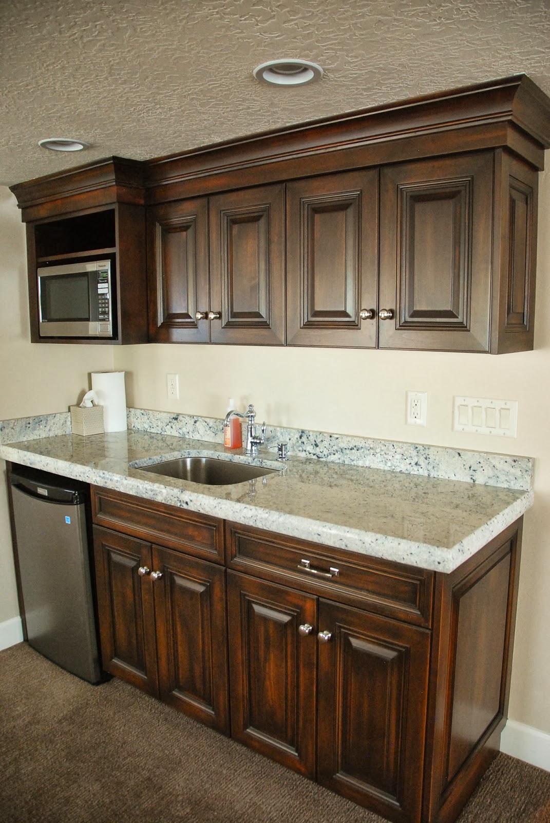 The Granite Gurus Bianco Romano Wet Bar & Vanities from MGS by Design