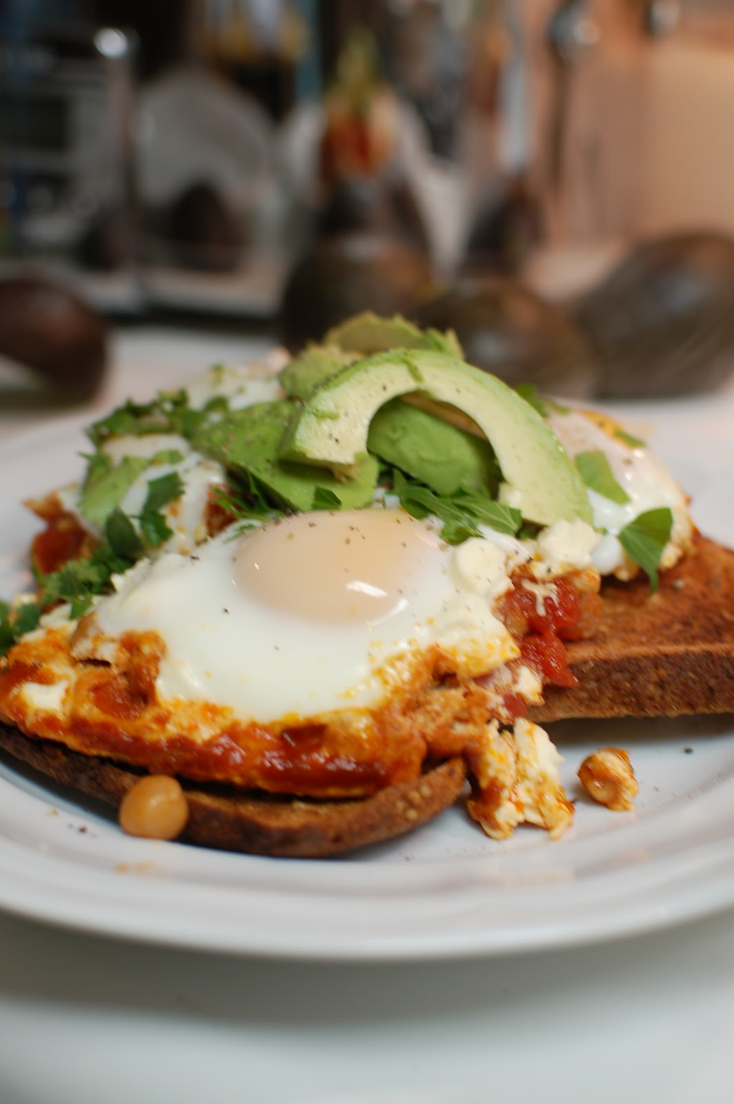 poached eggs in a delicious tomato sauce with chickpeas and feta lb's