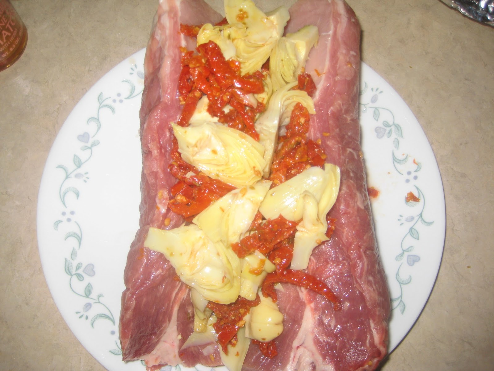 Flavorful and Fit Paleo Pork Loin Stuffed with Sun Dried Tomates and