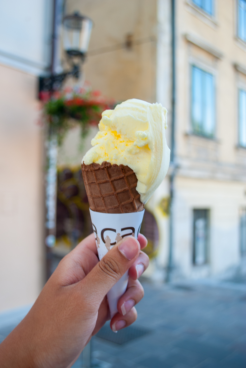 Ice-cream near the triple bridge having ice-cream near the triple bridge in ljubljana, slovenia