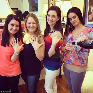 http://www.dailymail.co.uk/news/article-2895745/Hilarious-engagement-photo-shows-three-sisters-showing-rings-fourth-pouring-glass-champagne.html