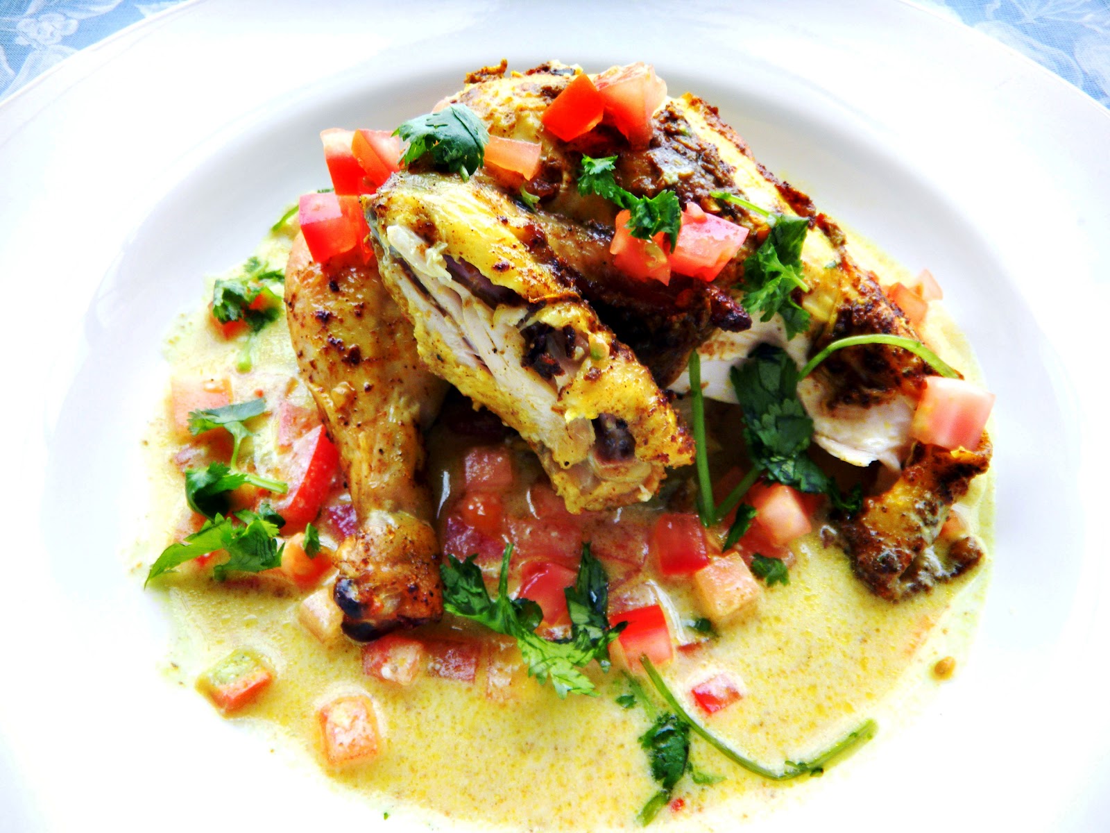 Cinnamon curry roasted chicken with tomato yogurt sauce and mango