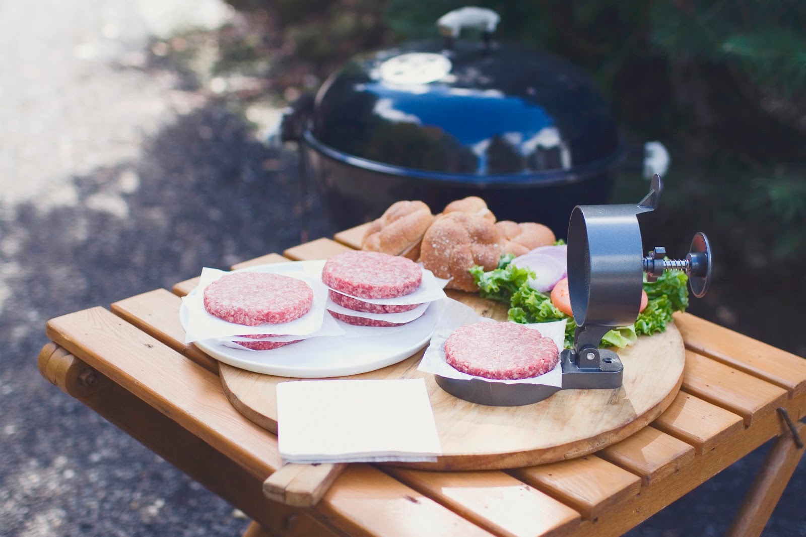 The burgers look good. Who doesn't marvel at a perfectly round, evenly dense patty?